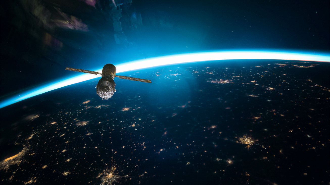 Space Satellite Flying Over the Earth